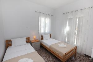 Postel nebo postele na pokoji v ubytování Aira Apartments