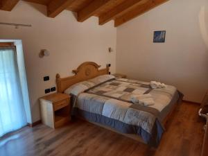 Postel nebo postele na pokoji v ubytování Agritur Girardelli