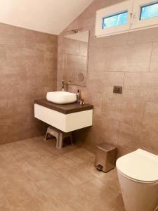 Ένα μπάνιο στο Seeblickwohnung Sirmione - Fronte Lago mit Privatsteg