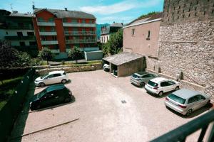 a group of cars parked in a parking lot at Appart 5 Charmant 2 pièces avec parking in Aix-les-Bains