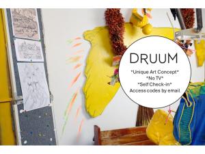 a drawing of a yellow object on a wall at B&B DRUUM in Brussels