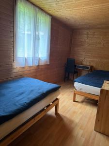 Postel nebo postele na pokoji v ubytování Chata Čertovy hlavy
