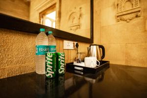 two bottles of water sitting on top of a table at Naman Haveli-Boutique Stay For Budget Travllers in Jaisalmer