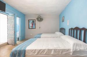 Ένα ή περισσότερα κρεβάτια σε δωμάτιο στο Espaciosa habitación comoda