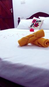Postel nebo postele na pokoji v ubytování Winstar Homestay