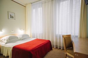 מיטה או מיטות בחדר ב-Rixwell Viru Square Hotel