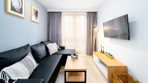 Μια τηλεόραση ή/και κέντρο ψυχαγωγίας στο VacationClub - Nadrzeczna 3E Apartament 16