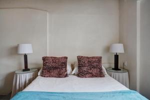 Ένα ή περισσότερα κρεβάτια σε δωμάτιο στο Kookfontein Farm Cottages