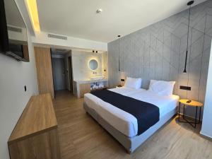 Voodi või voodid majutusasutuse Nireus Hotel toas