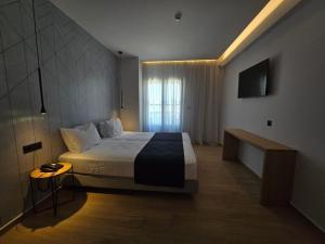 Voodi või voodid majutusasutuse Nireus Hotel toas