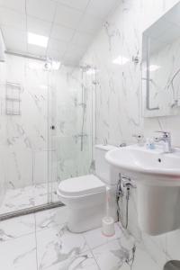 Koupelna v ubytování Deluxe City Hotel