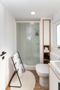 a bathroom with a toilet and a glass shower at Dream house by the sea in Grebaštica