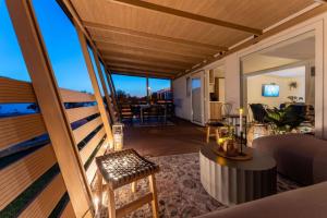 a room with a balcony with a view of the ocean at Dream house by the sea in Grebaštica