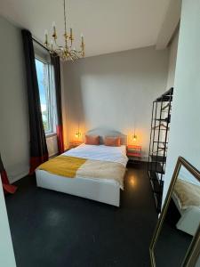 a bedroom with a bed and a ladder in it at 135qm Loft vor den Toren Hamburgs in Schenefeld