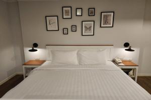 Postelja oz. postelje v sobi nastanitve J PLACE HOTEL