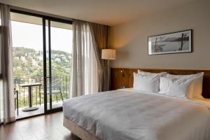 Voodi või voodid majutusasutuse HLS Dalat Lodge toas