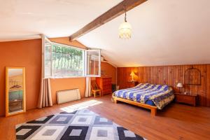 En eller flere senge i et værelse på La Villa du Broussan