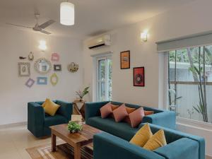 Uma área de estar em Rainforest Enclave, Arpora - 10 mins to Baga beach