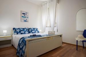 A bed or beds in a room at Villa Dema, sea front & beach 20 mt