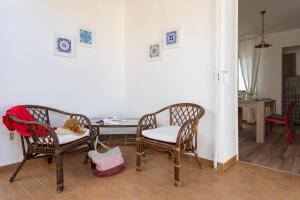 A seating area at Villa Dema, sea front & beach 20 mt