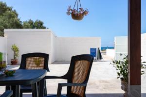 A balcony or terrace at Villa Dema, sea front & beach 20 mt