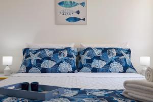 A bed or beds in a room at Villa Dema, sea front & beach 20 mt