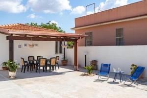A patio or other outdoor area at Villa Dema, sea front & beach 20 mt Még 26 kép