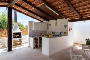 A kitchen or kitchenette at Villa Dema, sea front & beach 20 mt