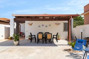 A patio or other outdoor area at Villa Dema, sea front & beach 20 mt