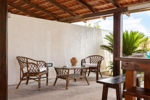 A seating area at Villa Dema, sea front & beach 20 mt