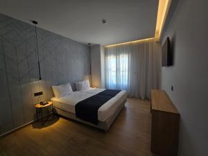 Voodi või voodid majutusasutuse Nireus Hotel toas