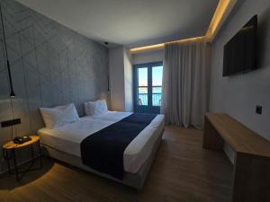 Voodi või voodid majutusasutuse Nireus Hotel toas