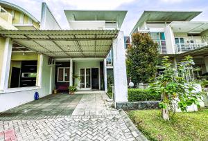 a house with awning on the front of it at Royal Residence 3BR Exclusive Town House in West Surabaya by Le Ciel Hospitality in Surabaya