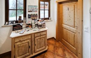 a room with a wooden counter and a window at Ferienwohnung In Hopfgarten in Hopfgarten im Brixental