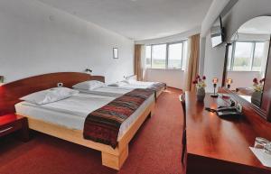 Postel nebo postele na pokoji v ubytování Hotel Krek Superior