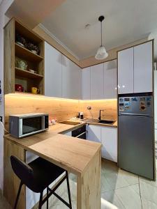 Kuchyň nebo kuchyňský kout v ubytování Ida's Apartment Durres