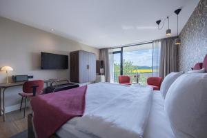 TV a/nebo společenská místnost v ubytování Van der Valk Hotel Melle - Osnabrück