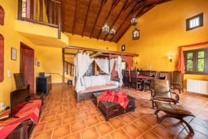 a living room with a bed and a table and chairs at Villa Nostos by Villa Plus in Svoronata