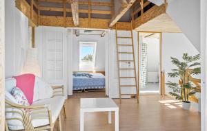 a living room with a loft bed and a bedroom at 4 Bedroom Nice Home In Harboøre in Harboør