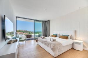 Postel nebo postele na pokoji v ubytování Villa Riva + 28 fotografií