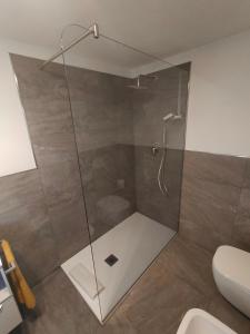 a shower with a glass door in a bathroom at Appartamento la vista 2 CIR 0110 in Aosta