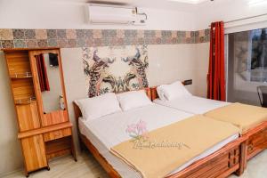 Postel nebo postele na pokoji v ubytování Lily Homestay + 19 fotografií