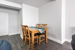 a dining room table with four chairs at Maritime House Two - 4BR Sleeps 10 Near City Centre in Hull
