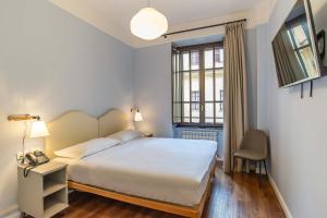 Ein Bett oder Betten in einem Zimmer der Unterkunft HOTEL DELLE CIVETTE