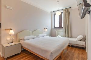 Ein Bett oder Betten in einem Zimmer der Unterkunft HOTEL DELLE CIVETTE