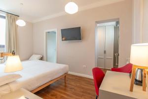 Ein Bett oder Betten in einem Zimmer der Unterkunft HOTEL DELLE CIVETTE