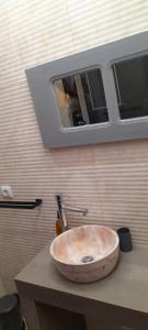 a sink on top of a counter with a window at Casa do Castelo in Gafanha da Nazaré +31 photos