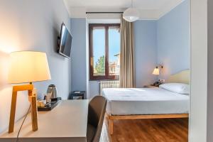 Voodi või voodid majutusasutuse HOTEL DELLE CIVETTE toas +24 fotot