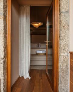 Ein Bett oder Betten in einem Zimmer der Unterkunft Vinha by NHôme