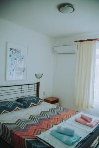 Postel nebo postele na pokoji v ubytování вила Лора